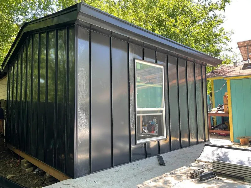 Black standing seam metal wall panels for Roof Inspection in Marrero